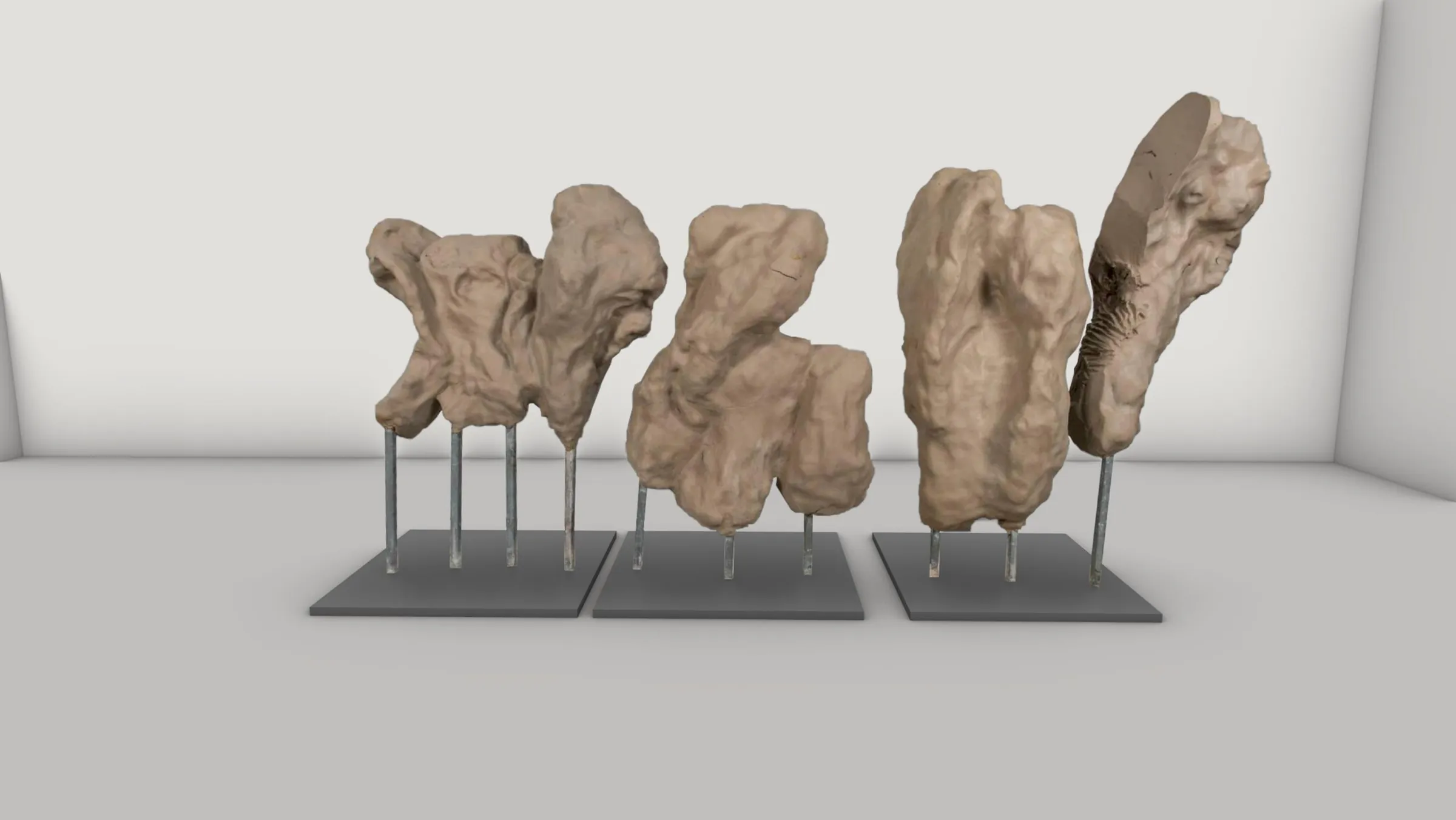 Model study of the sculptures on three dark bases.