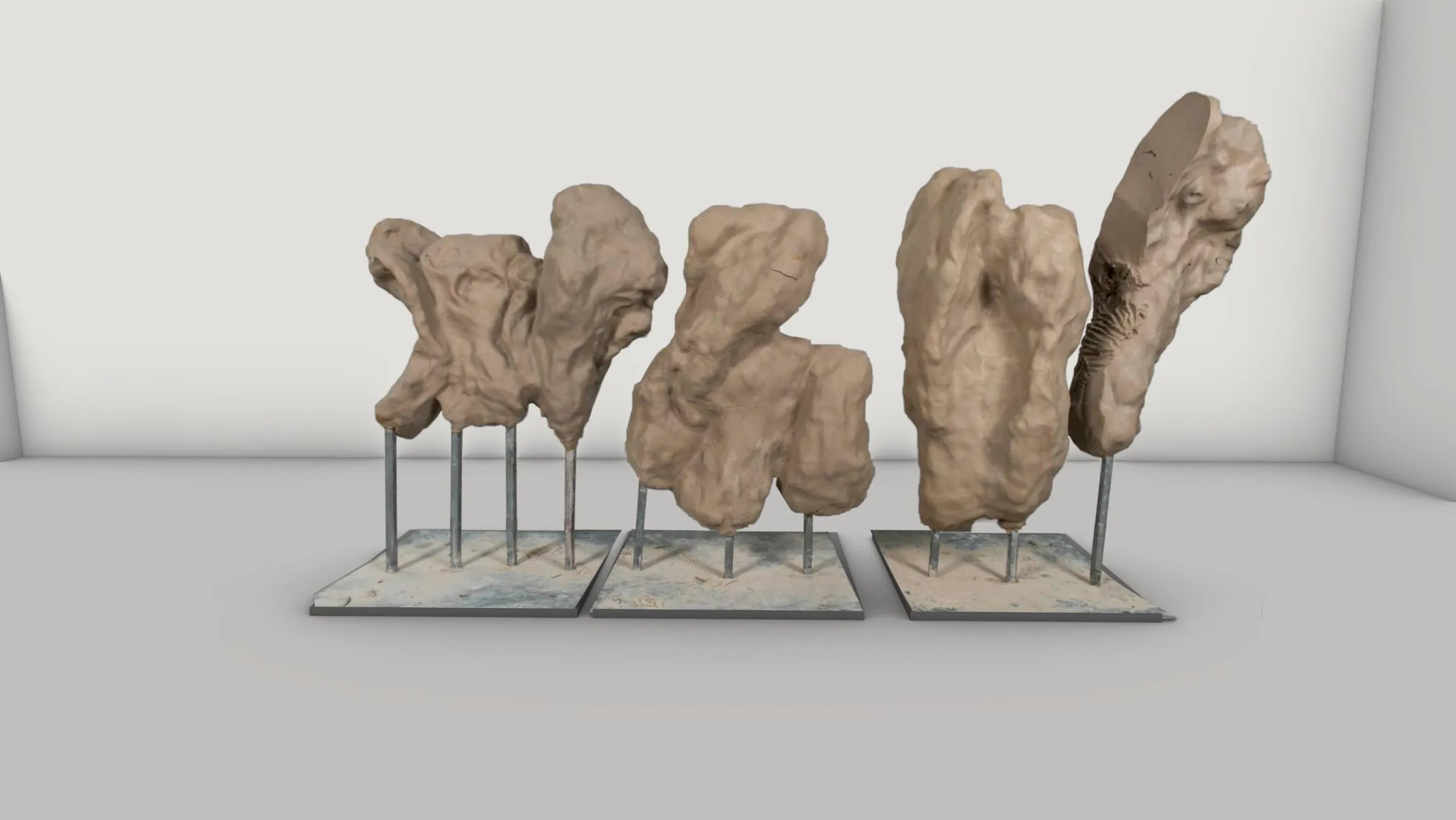 Model study of the sculptures and their metal supports on three surface bases.