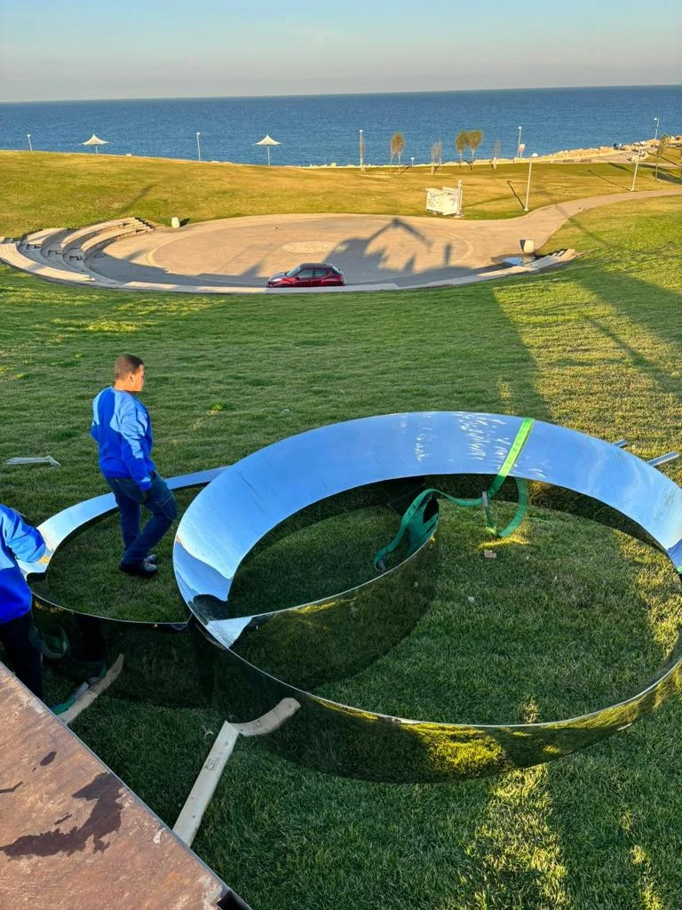A polished circular element being prepared for installation at Midron Park.