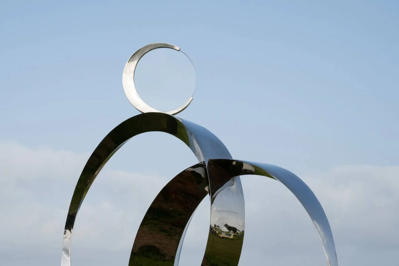 The completed Luna sculpture seen against the blue sky at Midron Park.